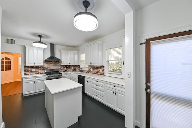 kitchen with wall chimney range hood, white cabinets, dishwasher, stainless steel range with gas cooktop, and decorative backsplash