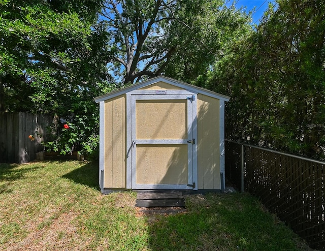 view of shed featuring a fenced backyard