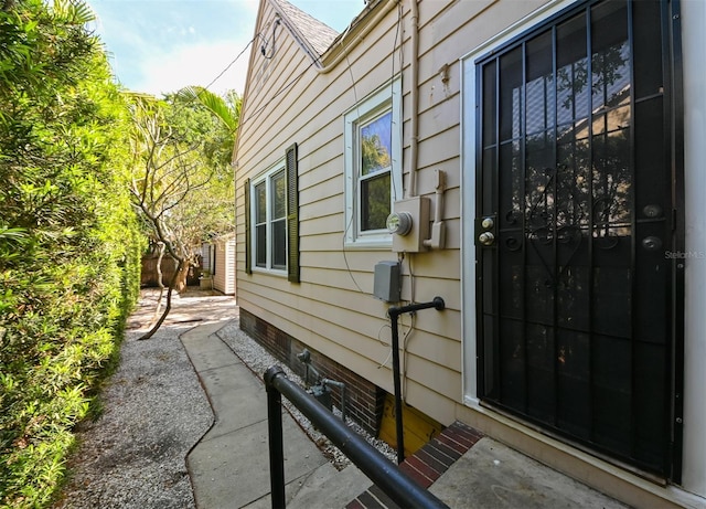 view of side of home with crawl space