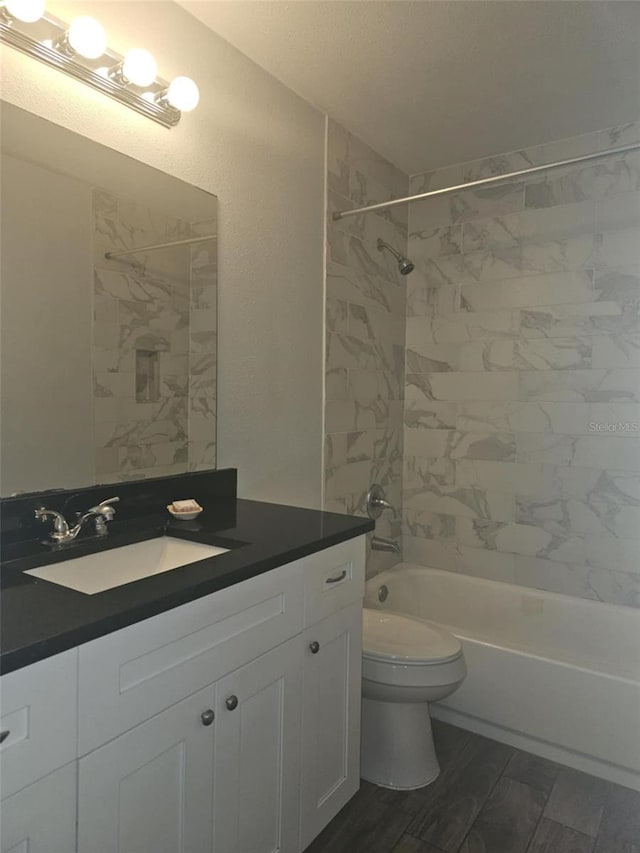 4043 La Pasida Ln, New Port Richey, FL 34655 - bathroom featuring bathing tub / shower combination, toilet, wood finished floors, and vanity