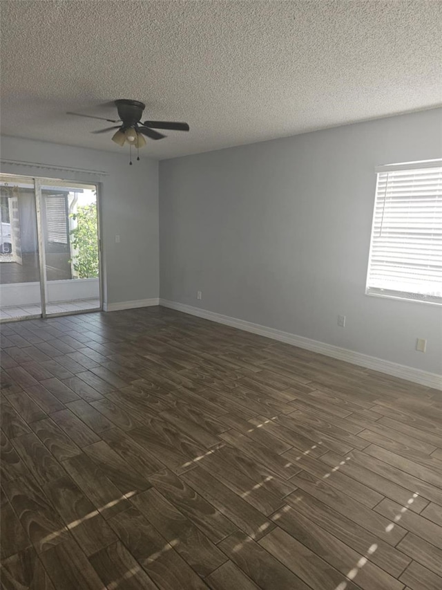 4043 La Pasida Ln, New Port Richey, FL 34655 - unfurnished room featuring a ceiling fan, dark wood-style flooring, a textured ceiling, and baseboards