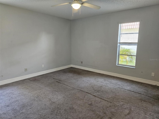 4043 La Pasida Ln, New Port Richey, FL 34655 - unfurnished room featuring dark carpet, a ceiling fan, and baseboards