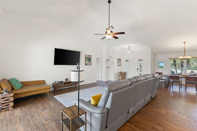 living room with ornamental molding, ceiling fan with notable chandelier, and wood finished floors
