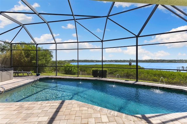 outdoor pool featuring a water view, a lanai, and a patio area