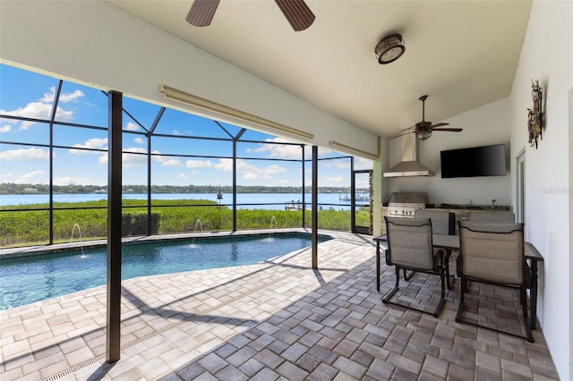 pool featuring a lanai, a ceiling fan, and a patio area