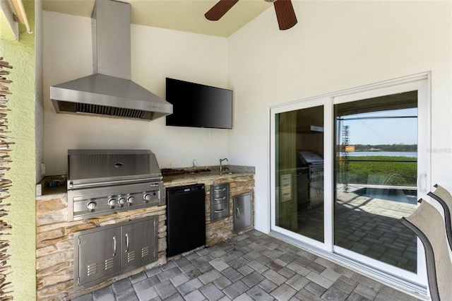 view of patio / terrace with an outdoor kitchen, a ceiling fan, and a grill