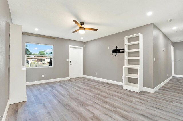 4310 S Coolidge Ave, Tampa, FL 33611 - unfurnished living room featuring baseboards, a ceiling fan, recessed lighting, and wood finished floors