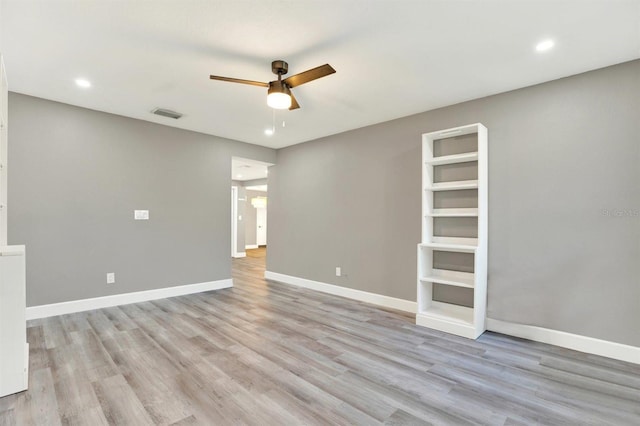 4310 S Coolidge Ave, Tampa, FL 33611 - unfurnished room with visible vents, light wood-style floors, baseboards, recessed lighting, and a ceiling fan
