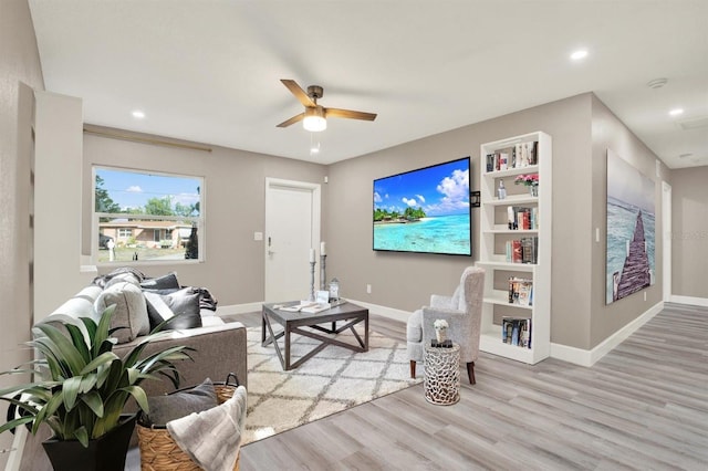 4310 S Coolidge Ave, Tampa, FL 33611 - living room with light wood-style floors, baseboards, a ceiling fan, and recessed lighting