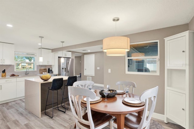 4310 S Coolidge Ave, Tampa, FL 33611 - dining space with light wood-style floors