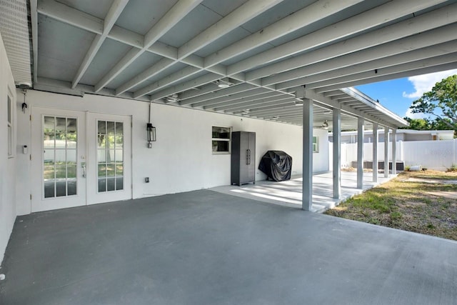 4310 S Coolidge Ave, Tampa, FL 33611 - view of patio featuring french doors, fence, and an attached carport