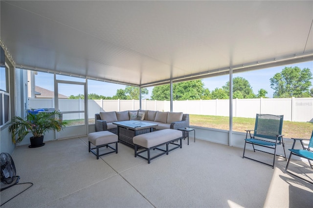 sunroom / solarium featuring an outdoor hangout area