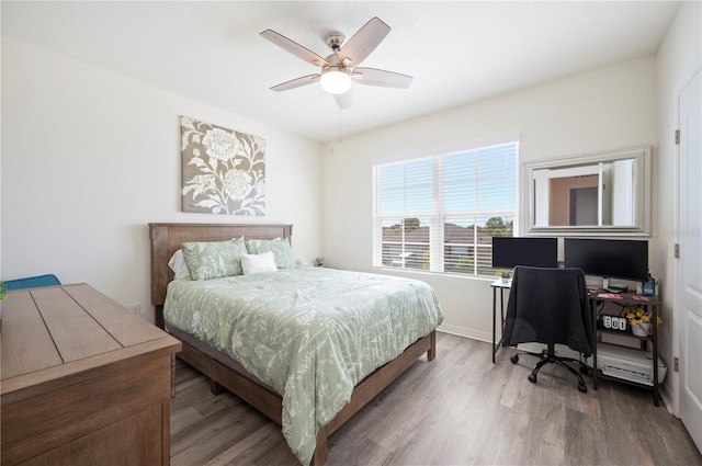 bedroom featuring a ceiling fan and wood finished floors
