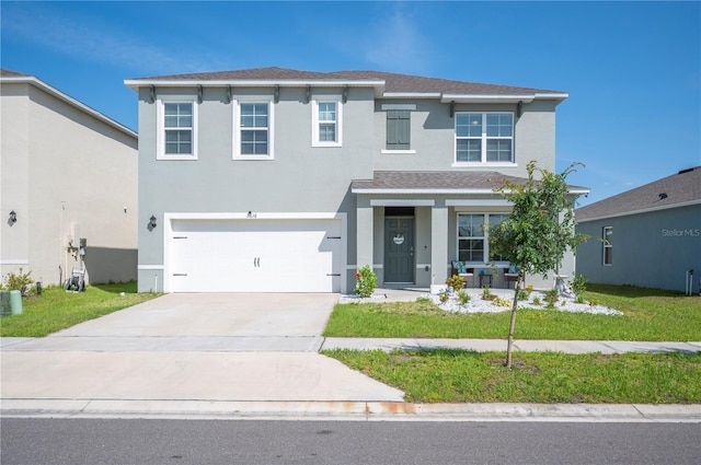 view of front of property with covered porch, a front yard, stucco siding, concrete driveway, and an attached garage
