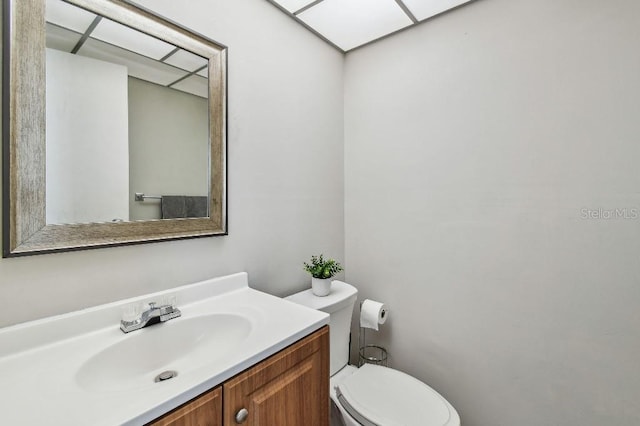bathroom with toilet and vanity