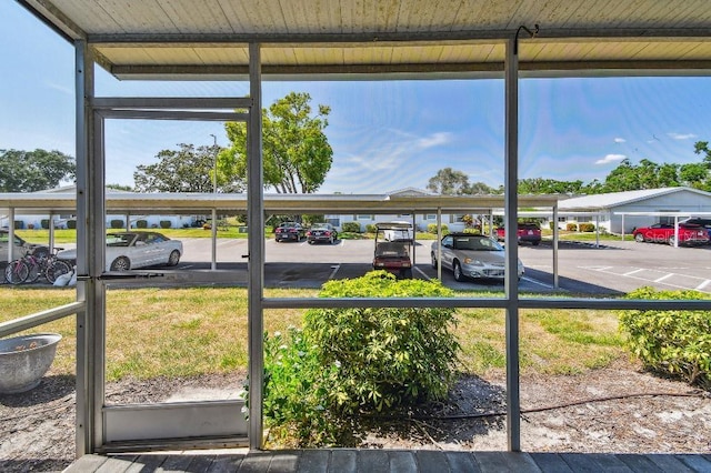 view of partially covered parking lot