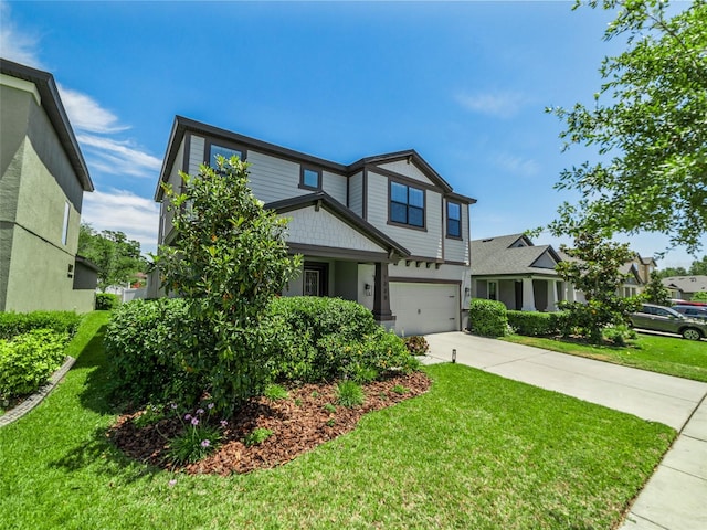 view of front of property featuring an attached garage, a front lawn, and driveway