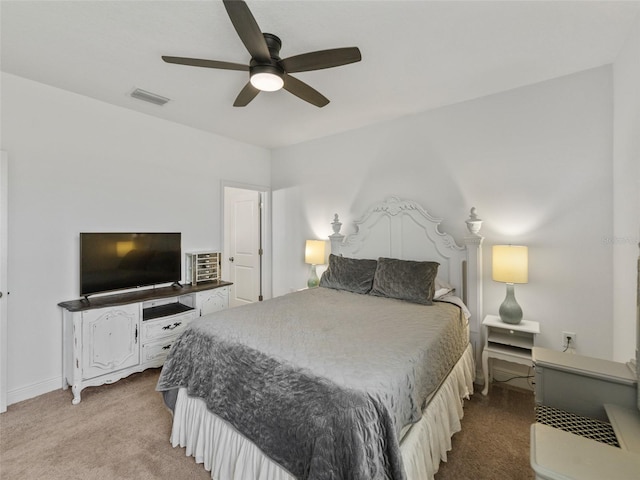 bedroom with baseboards, ceiling fan, carpet flooring, and visible vents