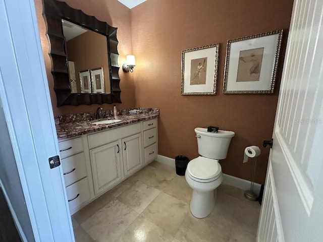 1056 Castle Pines Ct, Reunion, FL 34747 - bathroom with toilet, vanity, and baseboards
