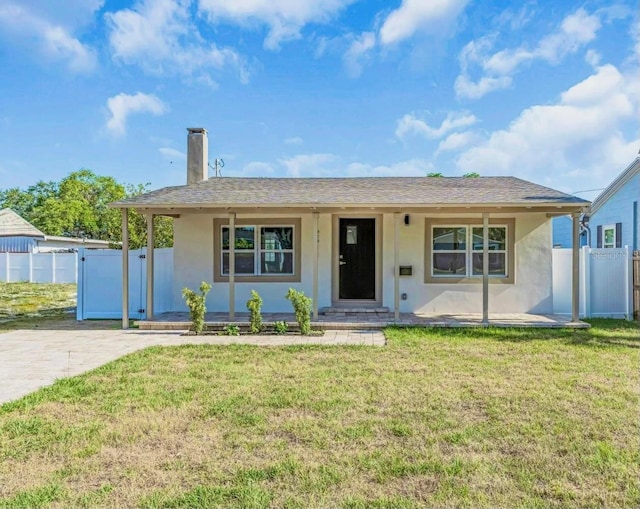2511 18th Ave N, Saint Petersburg, FL 33713 - single story home with fence, a front lawn, stucco siding, a porch, and a chimney