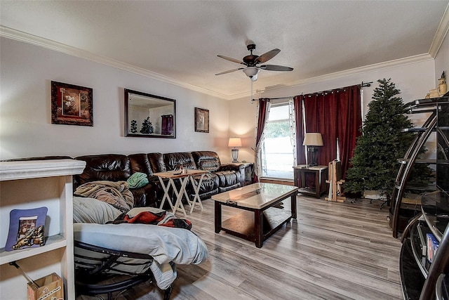 living room featuring light wood-style floors, crown molding, a textured ceiling, and ceiling fan