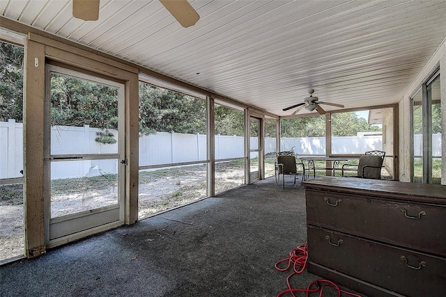 sunroom / solarium featuring ceiling fan