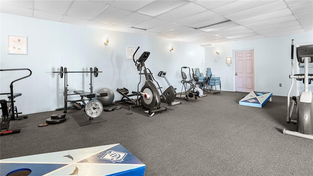 workout area with a paneled ceiling