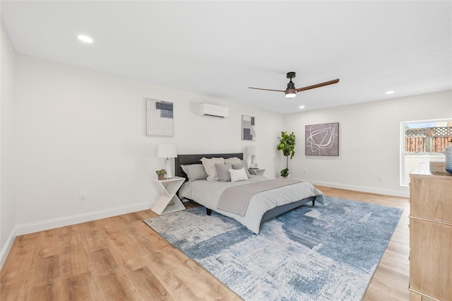 bedroom featuring light wood-type flooring, baseboards, and recessed lighting