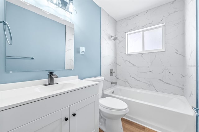 full bathroom featuring toilet, vanity, shower / bathtub combination, and wood finished floors