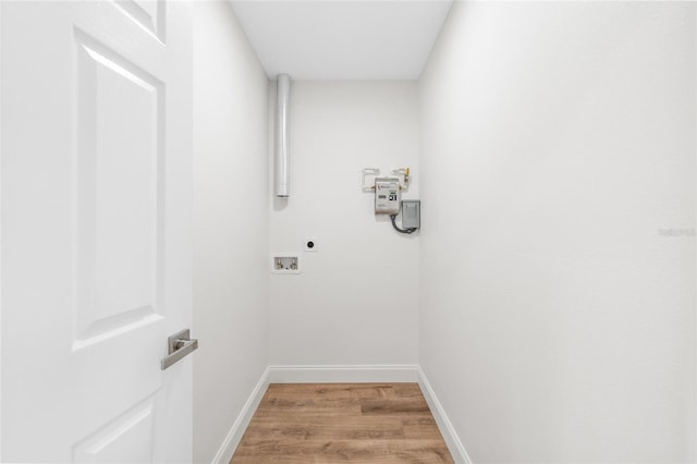 laundry area with hookup for an electric dryer, light wood-style floors, hookup for a washing machine, and baseboards