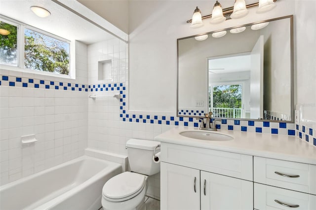 bathroom featuring vanity, decorative backsplash, and a wealth of natural light