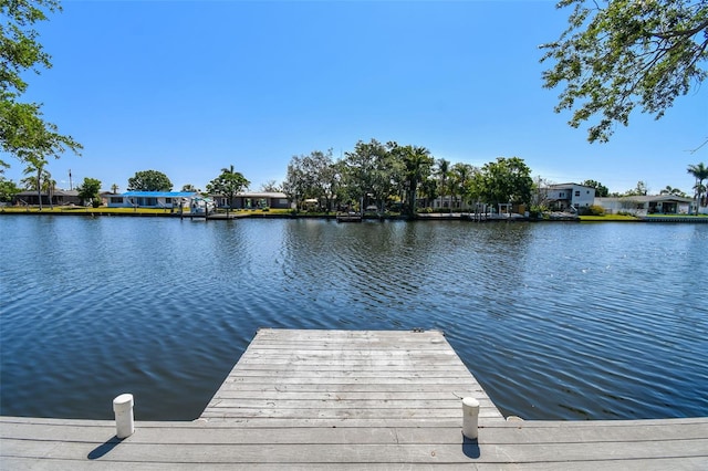 dock area with a water view and a residential view