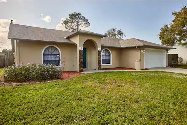 728 Alford St SE, Palm Bay, FL 32909 - ranch-style house featuring concrete driveway, an attached garage, a front yard, and stucco siding