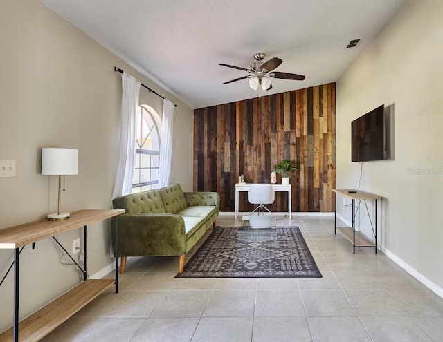 728 Alford St SE, Palm Bay, FL 32909 - tiled living room featuring baseboards, ceiling fan, wood walls, and visible vents