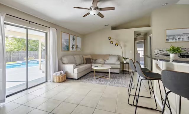 728 Alford St SE, Palm Bay, FL 32909 - living area featuring a wealth of natural light, ceiling fan, visible vents, and lofted ceiling