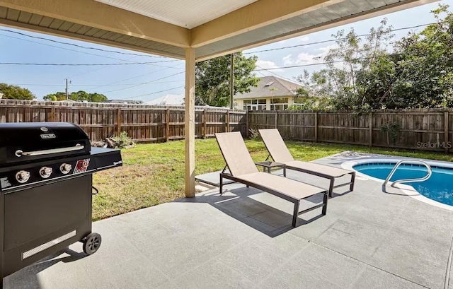 728 Alford St SE, Palm Bay, FL 32909 - view of patio / terrace featuring a fenced in pool, a fenced backyard, and area for grilling