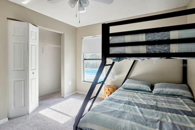 728 Alford St SE, Palm Bay, FL 32909 - carpeted bedroom featuring a closet, baseboards, and a ceiling fan