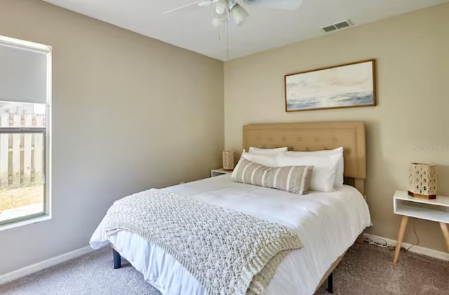 728 Alford St SE, Palm Bay, FL 32909 - carpeted bedroom with a ceiling fan, baseboards, visible vents, and multiple windows