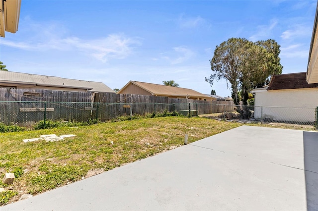 view of yard featuring a fenced backyard and a patio