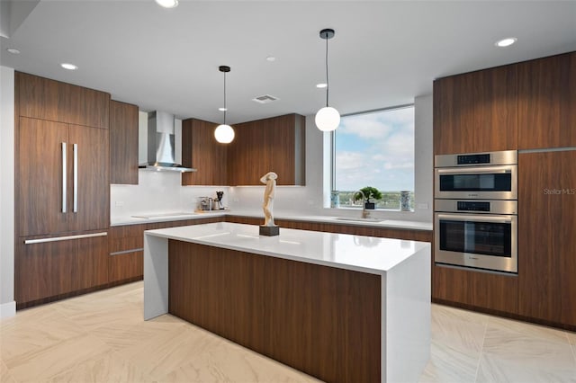 777 3rd Ave N Unit 1403, Saint Petersburg, FL 33701 - kitchen with wall chimney range hood, visible vents, modern cabinets, a sink, and double oven