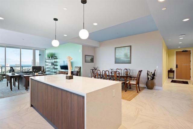 777 3rd Ave N Unit 1403, Saint Petersburg, FL 33701 - kitchen with a kitchen island, recessed lighting, open floor plan, and hanging light fixtures
