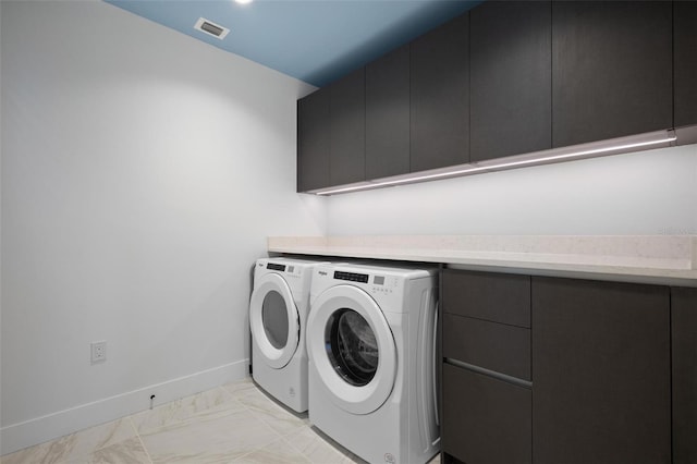 777 3rd Ave N Unit 1403, Saint Petersburg, FL 33701 - laundry area with visible vents, marble finish floor, baseboards, cabinet space, and independent washer and dryer