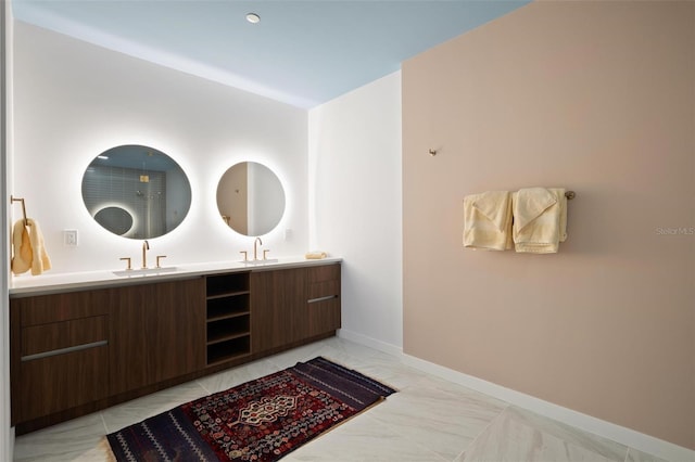 777 3rd Ave N Unit 1403, Saint Petersburg, FL 33701 - full bathroom featuring a sink, baseboards, double vanity, and marble finish floor