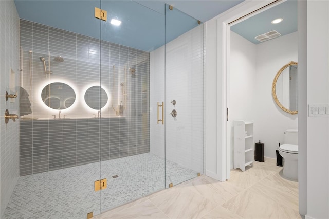 777 3rd Ave N Unit 1403, Saint Petersburg, FL 33701 - full bathroom with visible vents, marble finish floor, toilet, and a shower stall