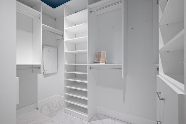 777 3rd Ave N Unit 1403, Saint Petersburg, FL 33701 - walk in closet featuring marble finish floor