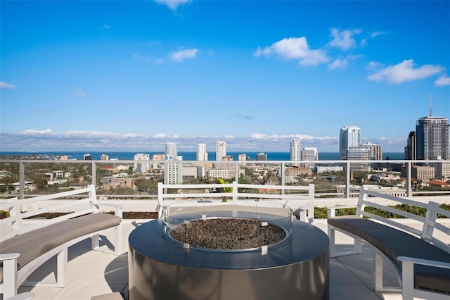 777 3rd Ave N Unit 1403, Saint Petersburg, FL 33701 - view of patio with a view of city, a fire pit, and a balcony