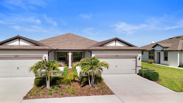 single story home with concrete driveway, stucco siding, and a garage