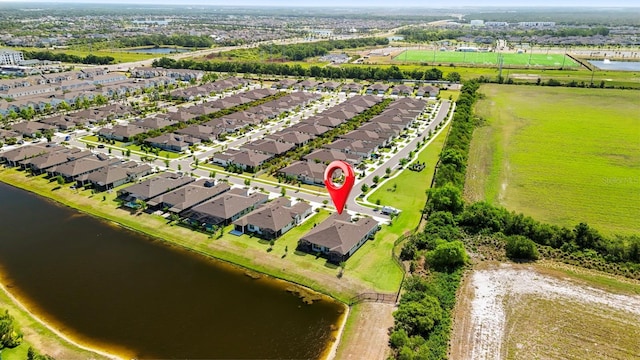 bird's eye view featuring a residential view and a water view