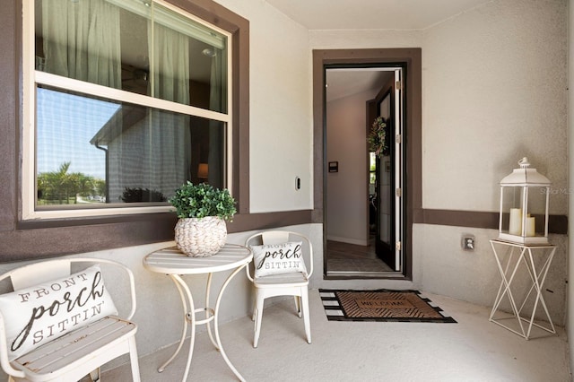 doorway to property with stucco siding