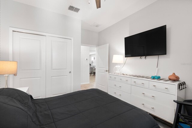 bedroom with a ceiling fan, a closet, and visible vents